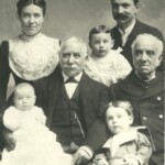 Centre Right: Isaac Harris (c1825-1909), Centre Left: Bernard (Berney) Harris Snr (Isaac’s son) (1863-1931)<br>Behind Isaac and Bernard Snr (Left to right): Leah Harris (nee Scharff) (1874-1931); Bernard Harris Jnr (1899-1980); Ben Scharff (Leah’s father) (Dates unknown to me)</br><br>
In front of Isaac and Bernard Snr (Left to Right): Robert Scharff Harris (1900-1970); Irwin Ralph Harris (1898-1989).</br><br>Photo courtesy of Anne Harris-Piccoli via Gerry Newnham</br>